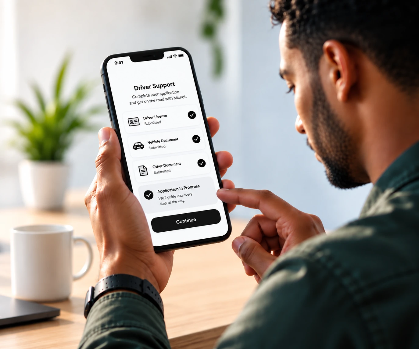 Prospective driver reviewing Michot Driver Support application requirements on a phone